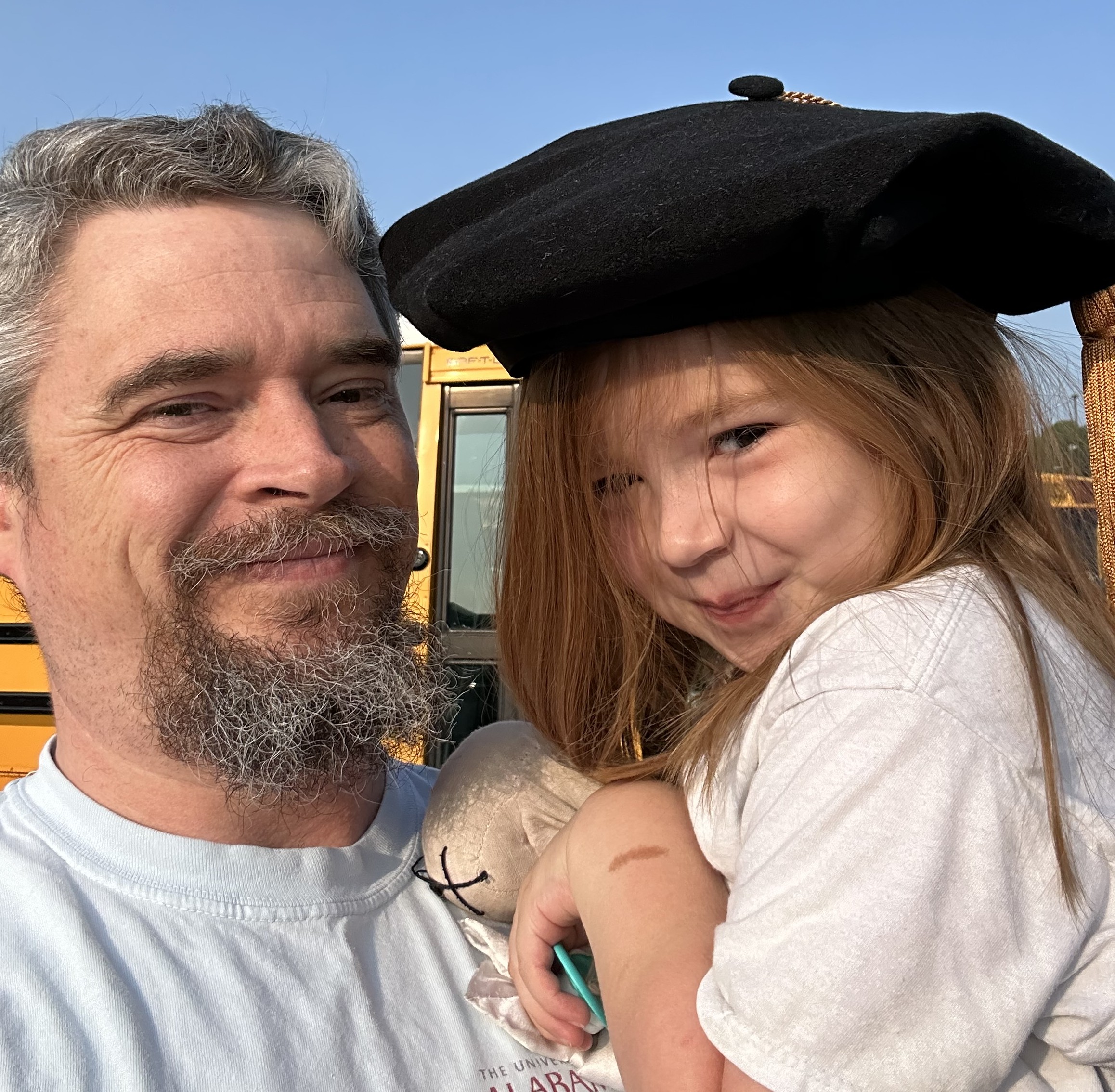 Spencer Stone with his daughter at the school bus